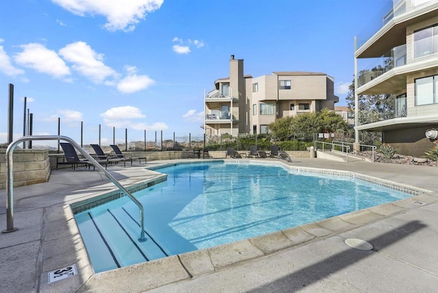 view of swimming pool with a patio