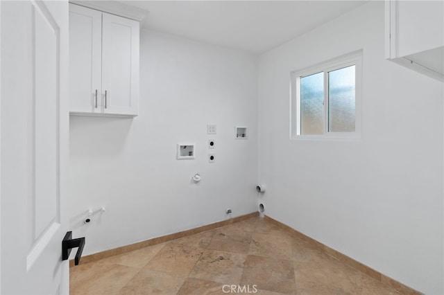 laundry area with gas dryer hookup, electric dryer hookup, hookup for a washing machine, and cabinets