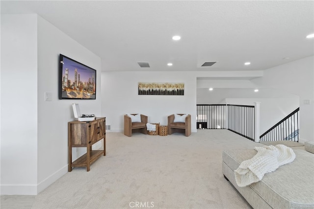 living area with light colored carpet