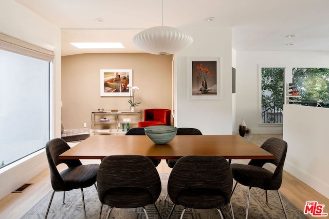 dining space featuring plenty of natural light and hardwood / wood-style floors