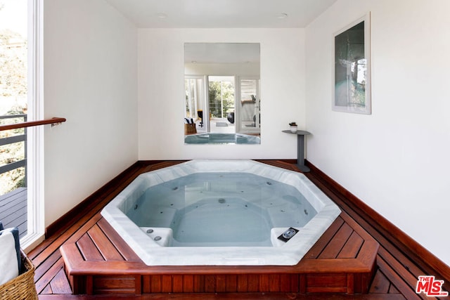 bathroom with a tub to relax in