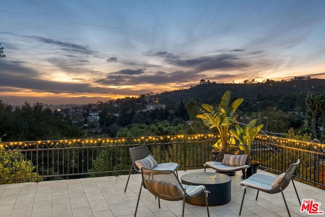 view of patio terrace at dusk