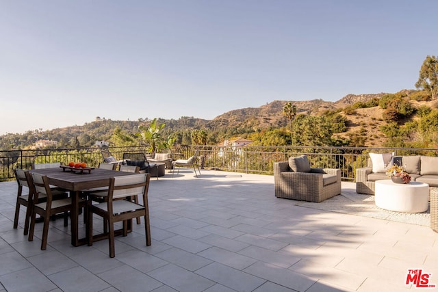 view of patio / terrace featuring a mountain view and outdoor lounge area