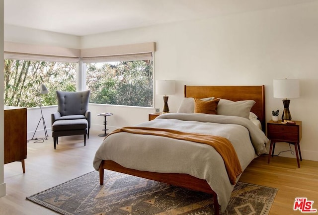 bedroom with light wood-type flooring