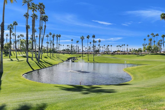 view of community with a yard and a water view