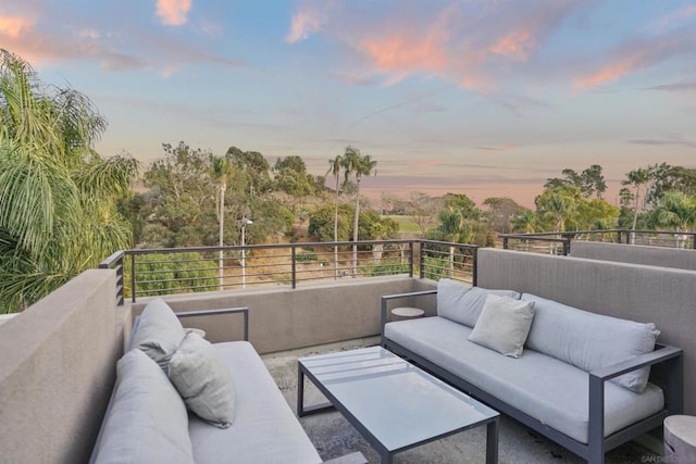 balcony at dusk with outdoor lounge area