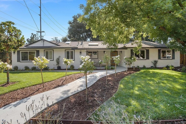 ranch-style house with a front yard