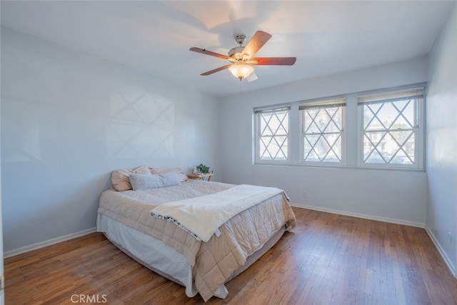 bedroom featuring ceiling fan and hardwood / wood-style floors