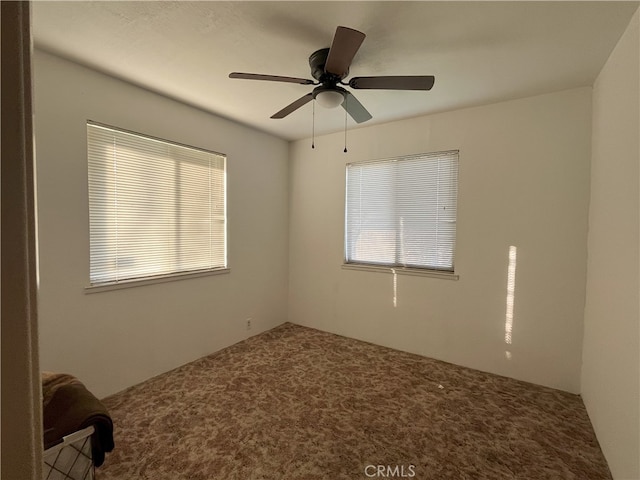 carpeted empty room with ceiling fan