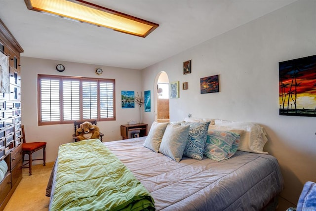 bedroom featuring light colored carpet