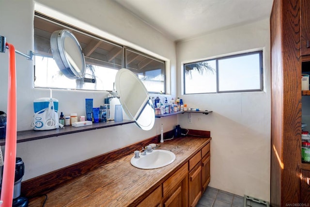 bathroom featuring tile patterned flooring and vanity