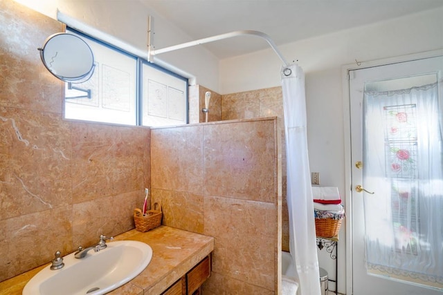 bathroom featuring vanity, plenty of natural light, and shower / tub combo with curtain