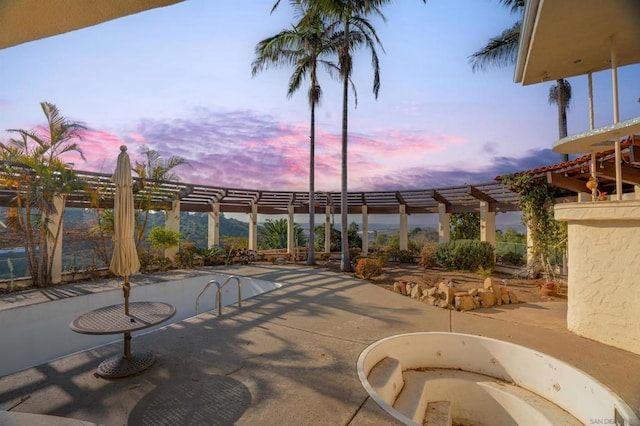 view of patio terrace at dusk