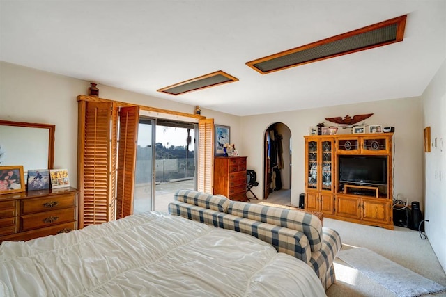 carpeted bedroom featuring access to outside