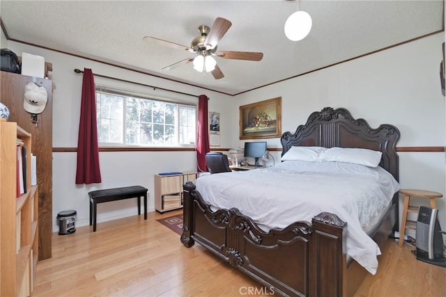 bedroom featuring light wood-type flooring and ceiling fan