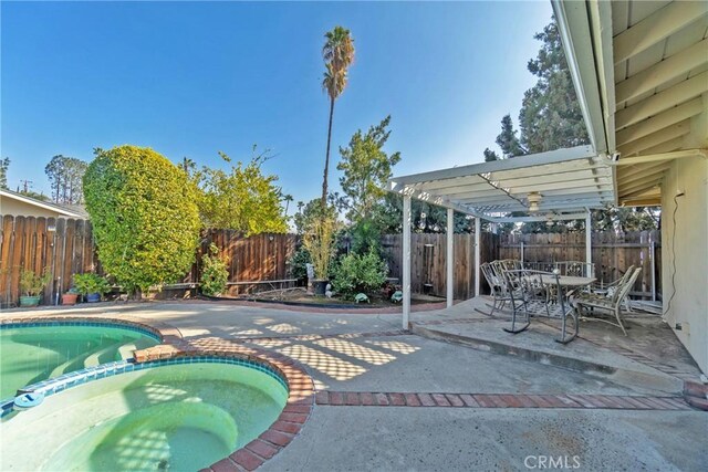 view of pool with an in ground hot tub, a patio, and a pergola