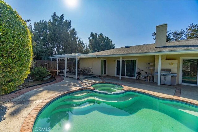 view of pool featuring a patio, an in ground hot tub, and a pergola