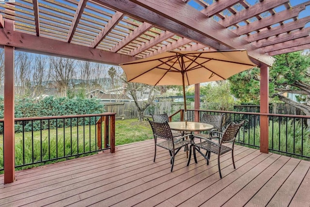 deck with a pergola and a yard