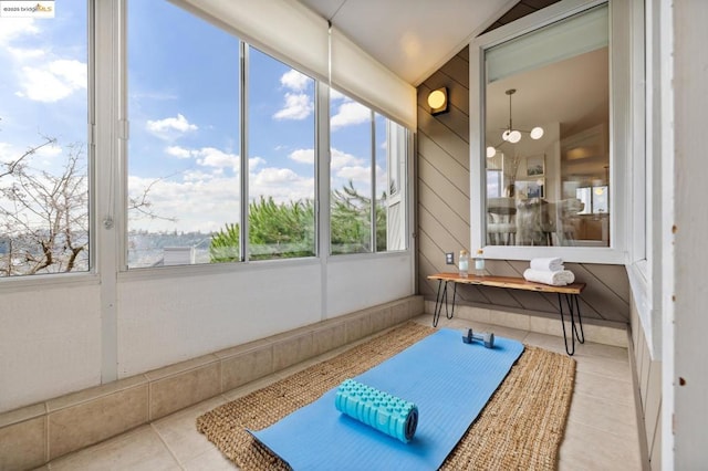 sunroom / solarium featuring lofted ceiling