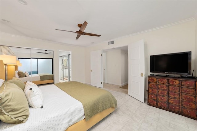 bedroom with ceiling fan and crown molding