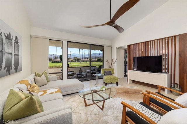 living room featuring vaulted ceiling and ceiling fan