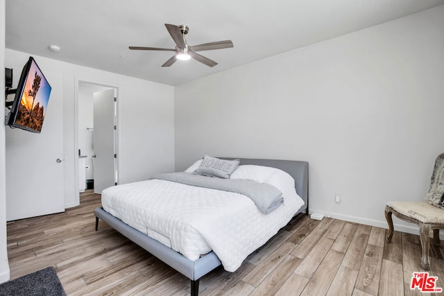 bedroom featuring ceiling fan and light hardwood / wood-style floors