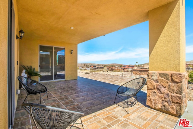 view of patio / terrace with a mountain view