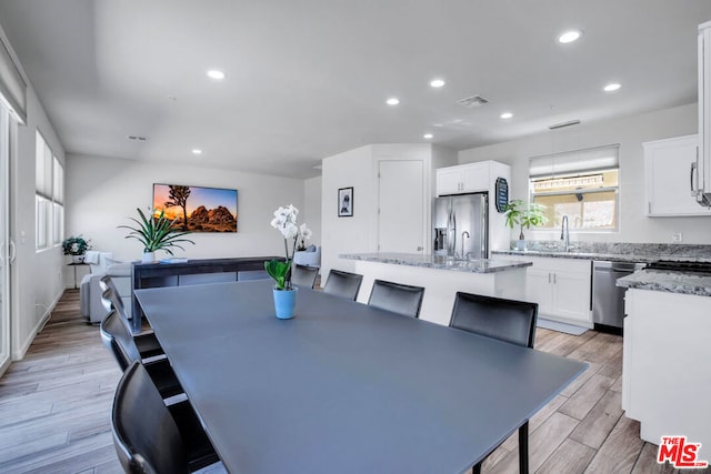 dining area featuring sink