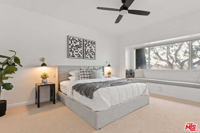 bedroom featuring ceiling fan and light colored carpet