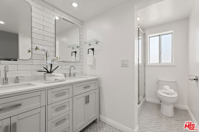 bathroom with vanity, backsplash, walk in shower, and toilet