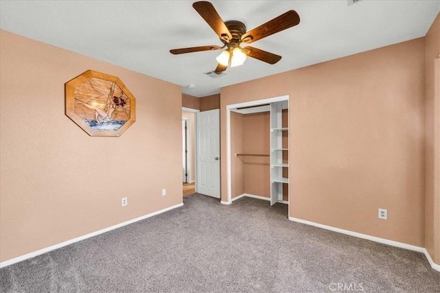 unfurnished bedroom featuring carpet flooring, a closet, and ceiling fan