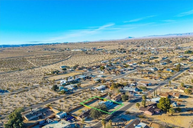 bird's eye view featuring a desert view and a mountain view