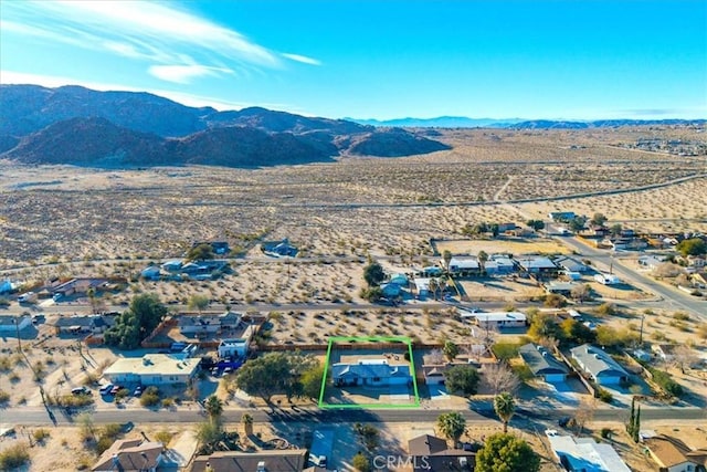 drone / aerial view featuring a mountain view