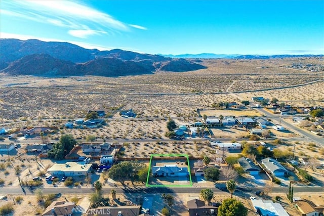 bird's eye view with view of desert and a mountain view