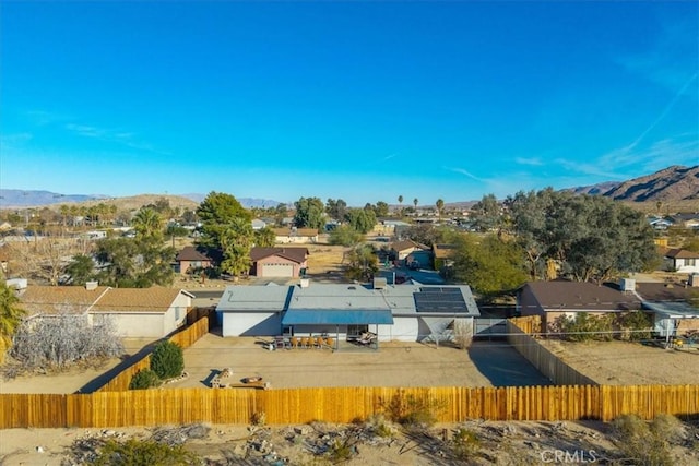 birds eye view of property with a mountain view