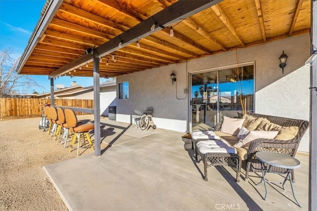 view of patio / terrace featuring exterior bar and an outdoor hangout area