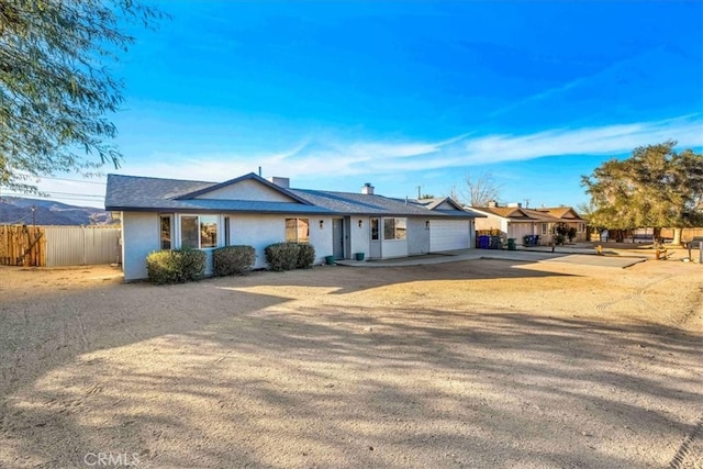 ranch-style house featuring a garage