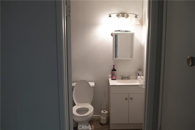 bathroom with toilet and vanity