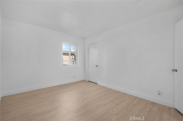 unfurnished room featuring light hardwood / wood-style floors