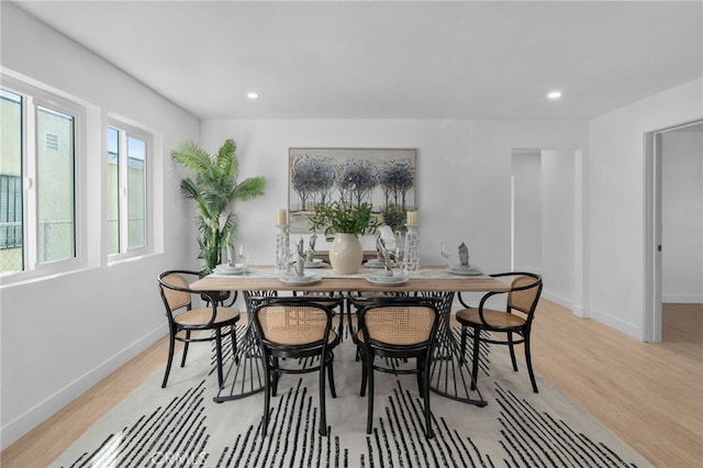 dining space with light wood-type flooring