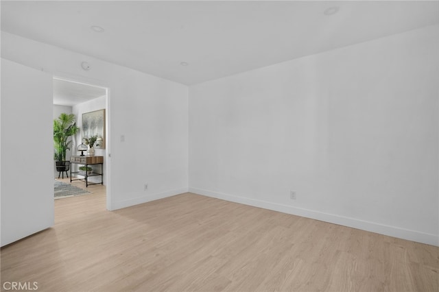 spare room featuring light hardwood / wood-style flooring