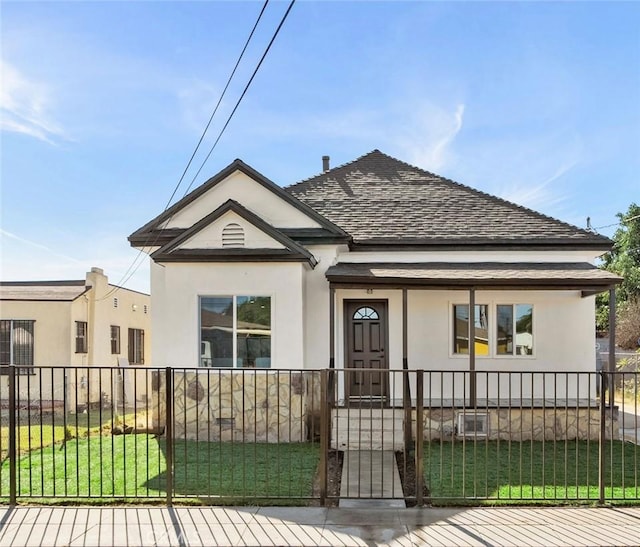 bungalow-style house featuring a front yard