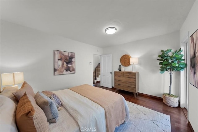 bedroom featuring dark hardwood / wood-style flooring