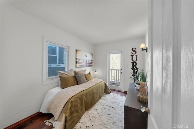 bedroom featuring light hardwood / wood-style flooring and access to outside