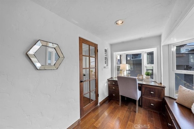 home office with hardwood / wood-style floors