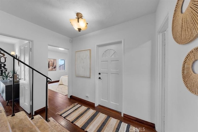 entryway featuring dark wood-type flooring