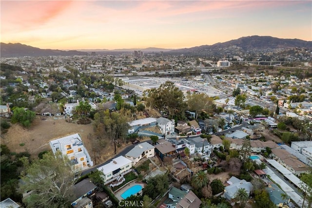 aerial view at dusk with a mountain view