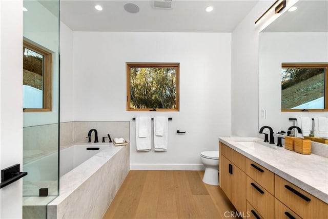 2456 Loy Ln, Los Angeles, CA 90041 - bathroom featuring recessed lighting, vanity, wood finished floors, and a healthy amount of sunlight