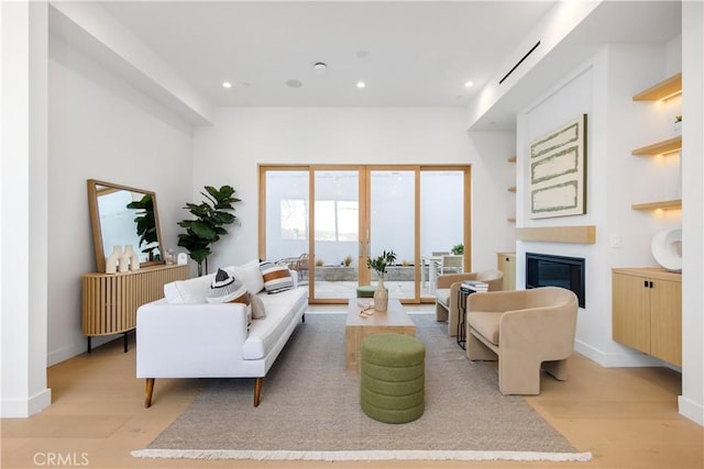 2456 Loy Ln, Los Angeles, CA 90041 - living area with recessed lighting, baseboards, light wood-style floors, and a glass covered fireplace