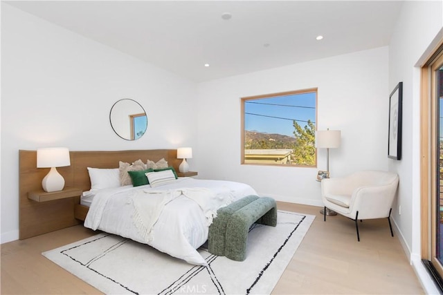 bedroom with light hardwood / wood-style floors